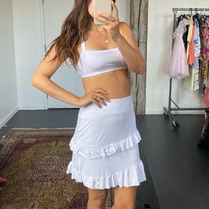 Size large white tennis skort with ruffles. Has shorts underneath